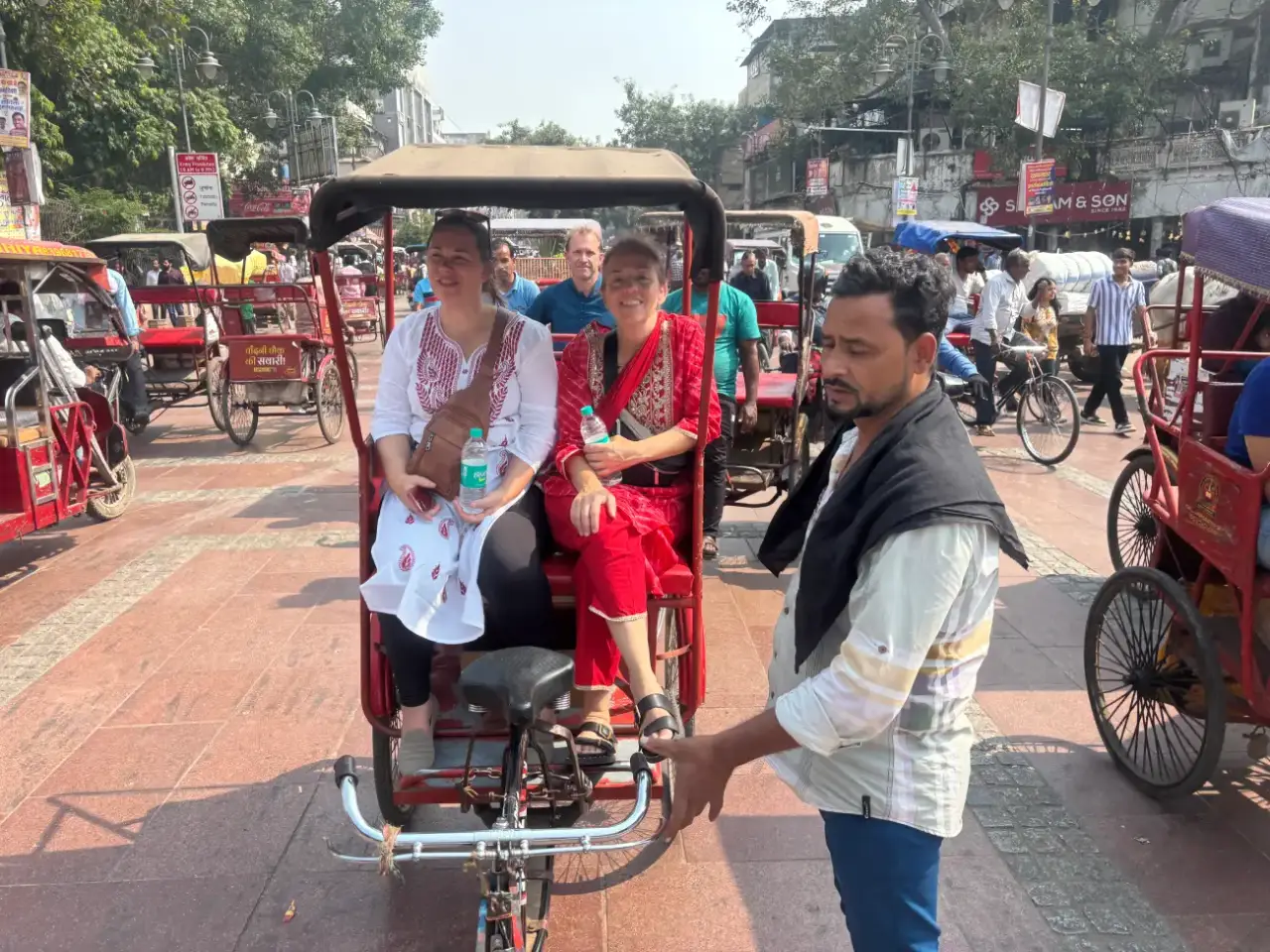 Welcome to Agra Trip Packages - A Government-Certified Travel Agency in Agra 41 Tourists-Enjoying-a-Cycle-Rickshaw-Ride-in-Old-Delhis-Chandni-Chowk-Market (1)
